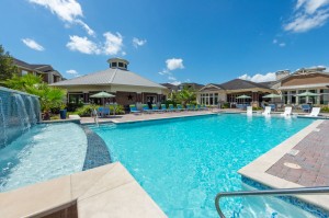 Apartments for Rent in Katy, TX - Pool with Waterfall, Tanning Shelf, Lounge Chairs